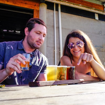 Couple doing beer and wine tasting